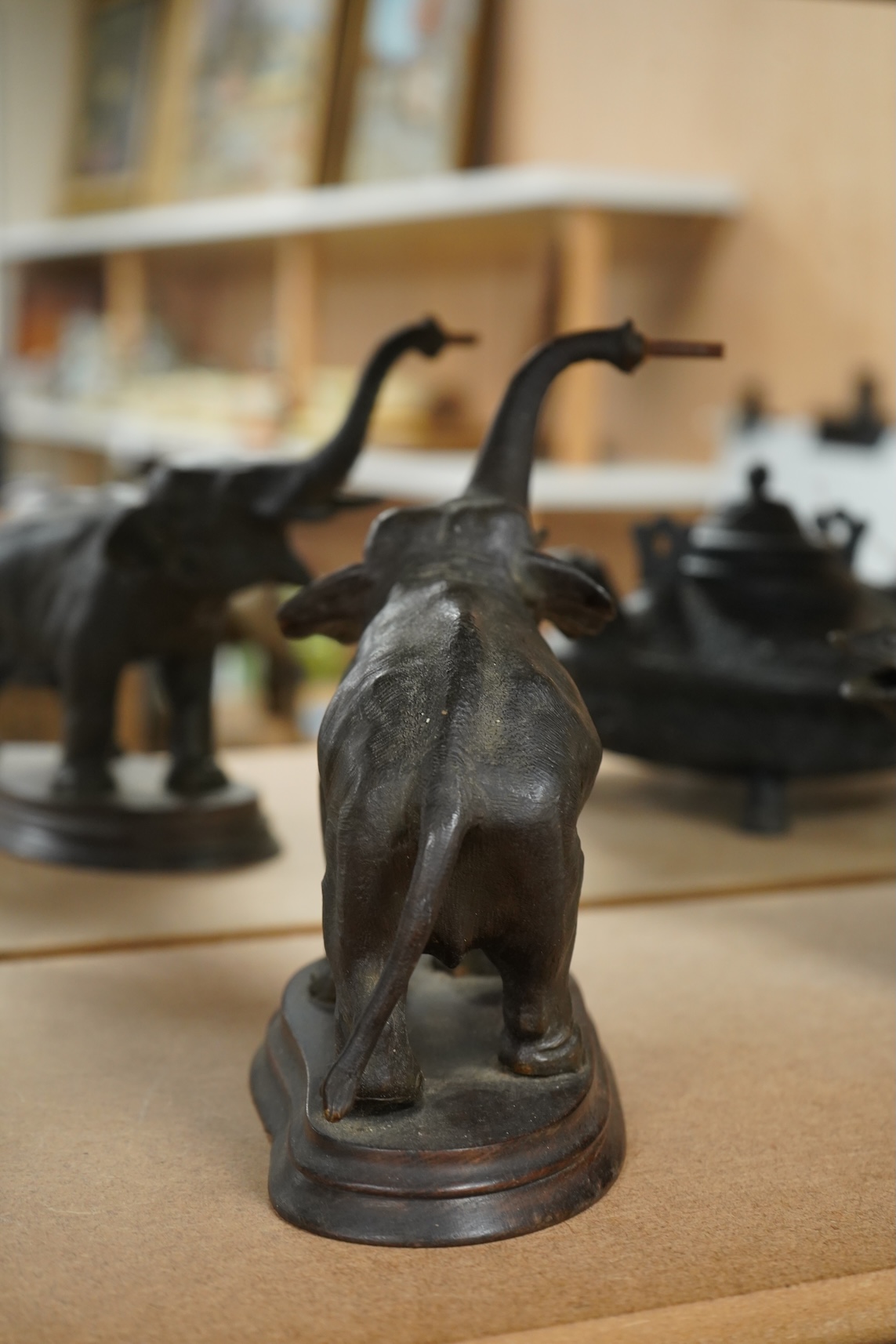 A bronzed metal model of an elephant and a bronze model of a greyhound, tallest 20cm